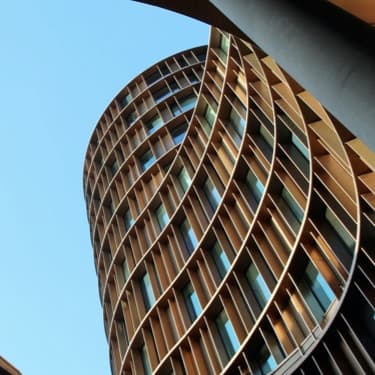 Curved architectural building viewed from below